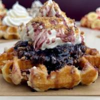 Blueberry Pie Waffle · Our delicious Belgian Pearl Sugar waffle, dusted with powdered sugar, topped with blueberry ...