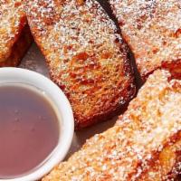 French Toast Sticks · Five French Toast Sticks, dusted with cinnamon and powdered sugar, served with syrup.
