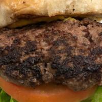 1/2 Lb Classic Burger · Angus ground chuck beef burger comes with: pickles, raw onions, lettuce, tomato and choice o...