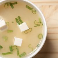 Miso Soup · Miso soup broth with green onion and soft tofu
