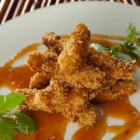 Fried Calamari · Tempura battered calamari steak sliced into pieces and dip fried served with special spicy s...