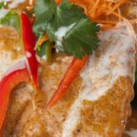 Salmon In Coconut Curry · Crispy salmon fillet immersed in your choice of red or green curry topped with coconut milk ...