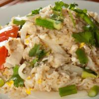 House Fried Rice · Jasmine rice wok tossed with egg, white onion, tomatoes and scallions.