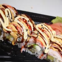Flaming Roll · Shrimp tempura avocado cream cheese inside with imitation crab on top. Drizzled with eel sau...