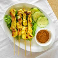 Chicken Satay (4) · Grilled marinated chicken on skewers served with Thai peanut sauce.