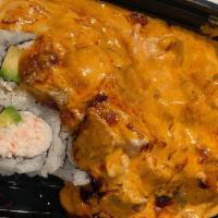 Dynamite Roll.  · 20 mins baked. Crab, avocado, topped with baked mayo and spicy crawfish.