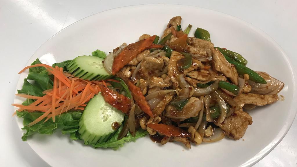 Pad Cashew Nut · Stir-fried white onion, scallion, bell peppers, carrot, and cashew nut in Nam Prik sauce.