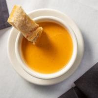 Lobster Bisque · Our signature creamy lobster bisque soup.