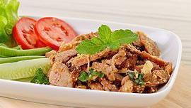 Naam Tok Salad · Medium hot. Strips of beef loin grilled then seasoned with chilies, rice powder, lime juice,...