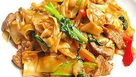 Pad Kee Mao · Medium hot. Stir-fried flat rice noodles, egg, onions, bamboo shoots, bell peppers, chili sa...