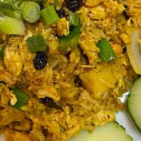 Pineapple Fried Rice · Nuts. Fried rice with curry powder, egg, pineapples, scallions, onions, raisin, and cashew n...