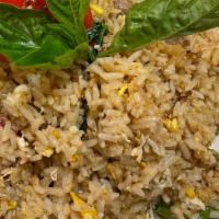Emerald Fried Rice · Medium hot. Spicy fried rice with green curry sauce, egg, bell peppers, onions, and basil.