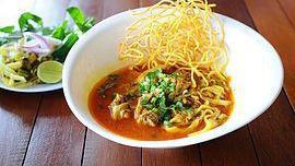 Khao Soy · Steamed egg noodles with chicken or fried tofu in thai red curry paste and coconut sauce. Se...