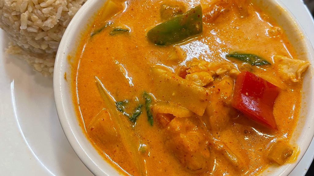 Red Curry · Spicy red curry with coconut milk, bamboo shoots, pineapple, bell peppers, tomatoes, and basil.