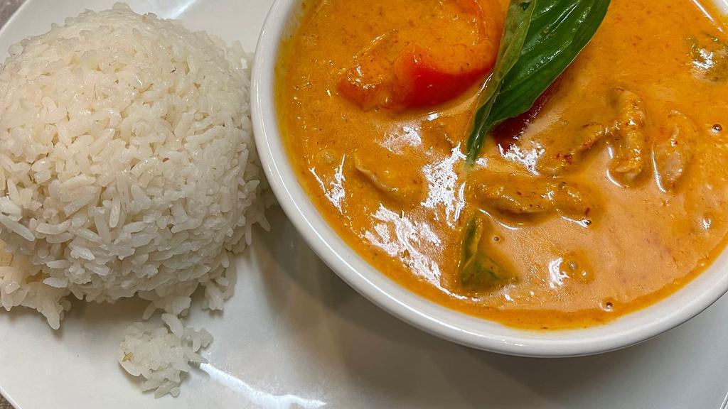 Panang Curry · Medium hot. Creamy panang curry with coconut milk, bell peppers, and lime leaves.