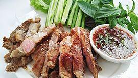Thai Bbq Pork · Marinated grilled pork tenderloin in Thai spices. Served in hot plate with sweet and sour sauce or Thai chili sauce on the side.