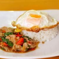 Pad  Kra Prow With Fried Egg · Minced ground pork/chicken/beef sauteed with fresh chilies, garlic, onions, bell peppers, gr...