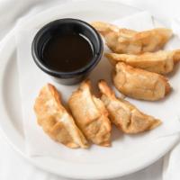 Gyoza · 6 pc fried Japanese dumplings with pork and vegetables. Included is tempura sauce. 

*Note* ...