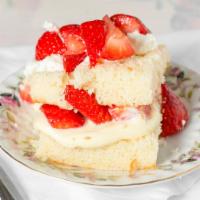 Strawberry Shortcake · Our homemade vanilla cake layered with pudding, cream. & strawberries!