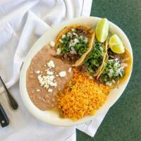 Taco Plate  · Three tacos of your choice of meat with rice and beans.
