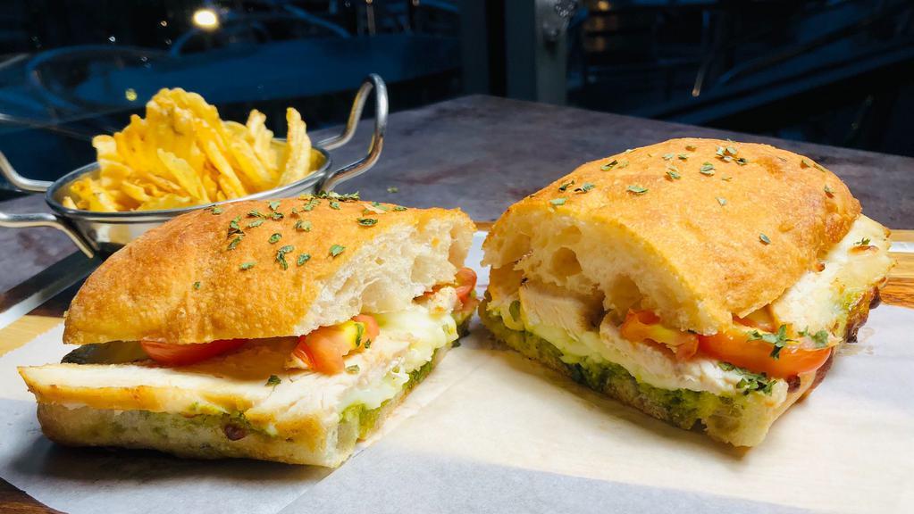 Chicken Pesto Panini · Grilled chicken breast, genovese basil pesto, fresh tomato and fresh mozzarela.
 Served with a salad or chips.