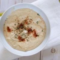 Hummus · The famous mashed chickpea mixture with fresh lemon juice, tahini sauce, and garnished with ...