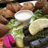 Mary'Z Sampler · Includes three falafels, two kibbi, three pies of each and four grape leaves.
