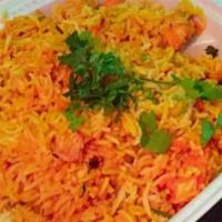 Chicken Biryani · Traditionally cooked basmati rice and chicken together in biryani sauce and spices.