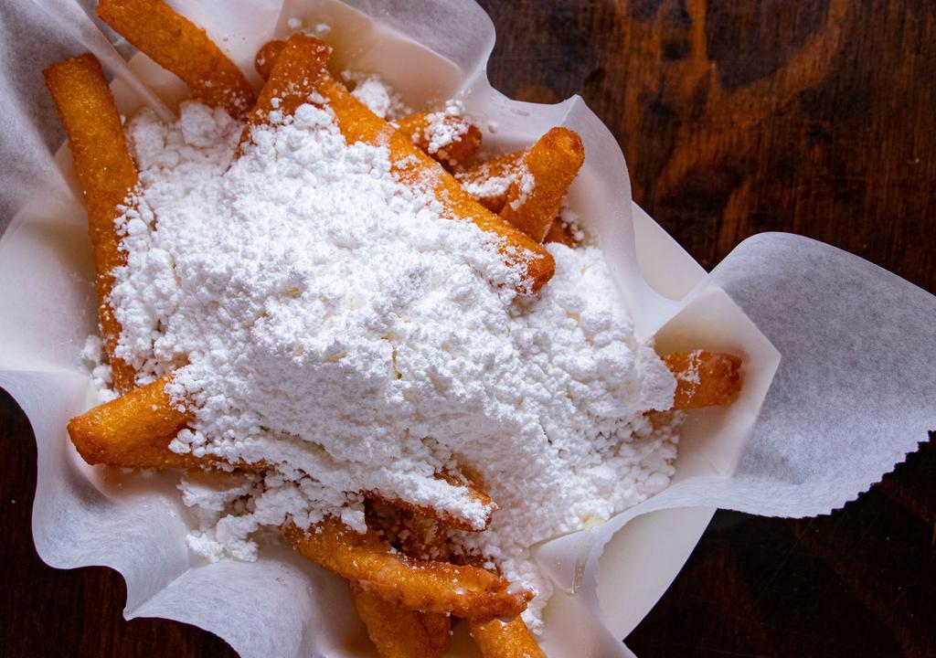 Beignets · The perfect way to end your epic meal at your LA Crawfish! Crisp, golden, and a fluffy center. Our special take on traditional beignets dusted with powdered sugar and condensed milk drizzle.