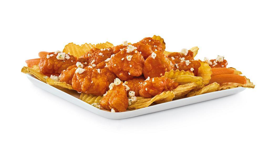 Buffalo-Style Boneless Wings · Tender and crunchy all-white chicken meat tossed in our signature Buffalo wing sauce with crumbled Blue cheese and carrot sticks, served on a bed of kettle chips.