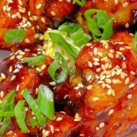 Korean Fried Cauliflower · Sweet and spicy gochujang glaze, Asian slaw, toasted sesame seeds, green onions.