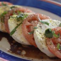 Caprese Salad · Stacked fresh mozzarella & tomato slices with fresh basil, olive oil, balsamic vinegar, & se...