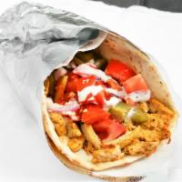 Chicken Shawarma Wrap · Slices of grilled chicken breast, pita bread, tomatoes, pickles, onions, white (tzatziki) sa...
