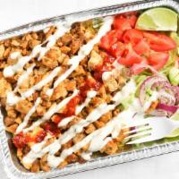Chicken Shawarma Over Rice · Slices of grilled chicken breast, basmati rice, lettuce, tomatoes, cucumbers, red onions, pi...