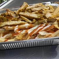 Chicken Over Fries · Sliced chicken over french fries, ketchup, white (tzatziki) sauce, and hot (spicy) sauce.
