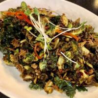 Brussels Sprouts · Crispy brussels sprouts, kale, and roasted almonds with balsamic sweet sauce.
