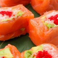 Mama Roll · Crabmeat, avocado and tobiko wrapped in soy bean paper and salmon with drizzled ponzu sauce ...