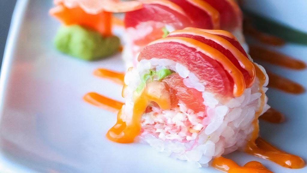 Charming Roll · Spicy. Crabmeat, salmon, avocado, wrapped in soybean paper, topped with tuna and spicy mayo.