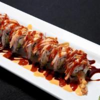 Sunny Roll · Spicy. Shrimp tempura, avocado, cream cheese, crabmeat topped with eel sauce, chili sauce an...