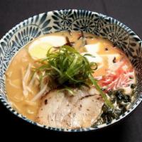 Tempura Udon Noodles · Traditional Japanese noodles, inari, shitake mushrooms served with shrimp and vegetable temp...