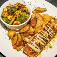 Blackened Salmon · Blackened salmon drizzled with creole garlic butter sauce.