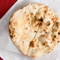 Naan · Classic Indian bread cooked in the tandoor clay oven.