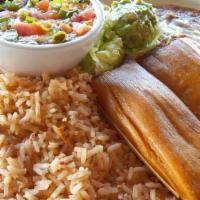 Tamales · A Tex-Mex staple! Our new beef Tamales, served with chili con carne.