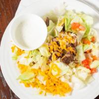 Fajita Salad · A fresh bed of chopped lettuce topped with your choice fajita steak or chicken and completed...