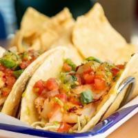 Shrimp · Grilled with Corn Tortillas, Tomatillo Salsa, Pico De Gallo and Cabbage.  Served with Chips ...