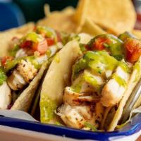 Chicken · Grilled with Corn Tortillas, Tomatillo Salsa, Pico De Gallo and Cabbage.  Served with Chips ...