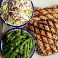 Grilled Pork Chops · Two 6-Ounce Chops.  Served with Two Sides.