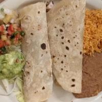 Burritos Al Carbón · 2 flour tortillas your choice of meat  covered with chilli gravy and cheddar cheese served w...
