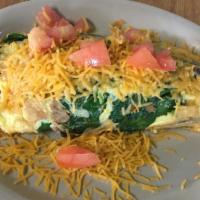 Garden Omelet · Spinach, bell peppers, tomatoes, mushrooms, onions and cheddar cheese.