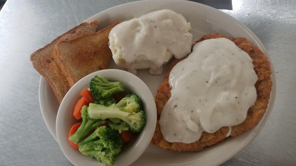 Chicken Fried Steak · A hand breaded golden fried chicken fried steak topped with country gravy.